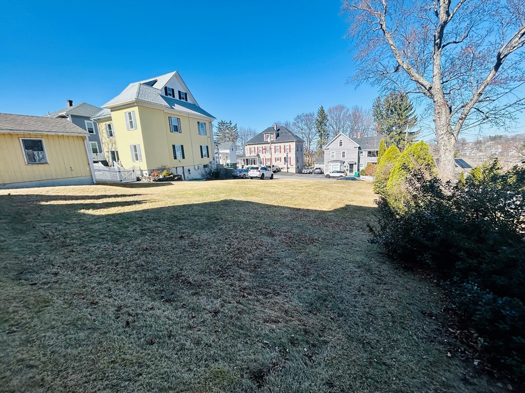 5 Richman Street Clinton, MA 01510 - Photo 3 of 4 a view of a house with backyard and trees