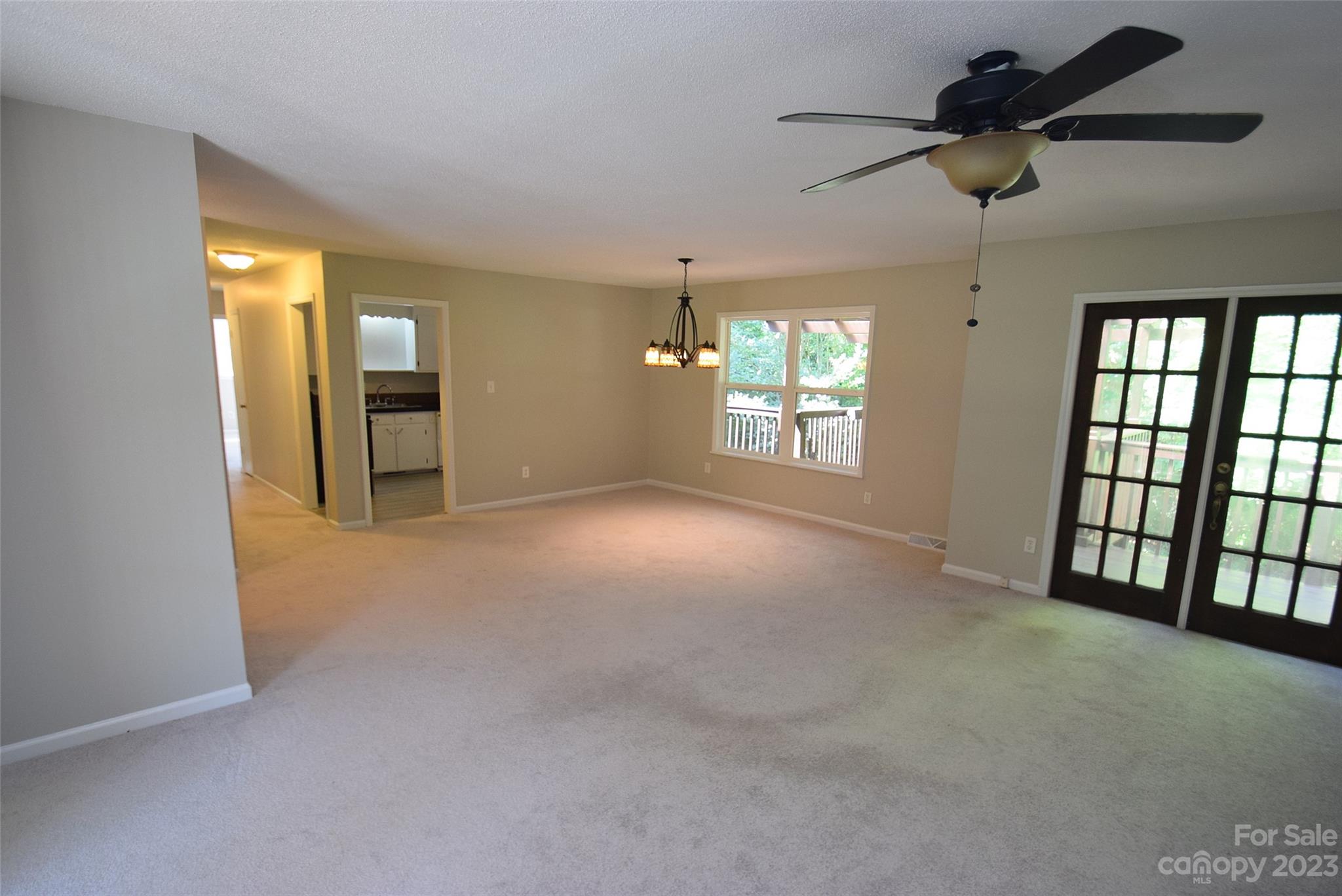 8429 Fieldwood Road Mint Hill, NC 28227 - Photo 18 of 28 a view of entryway and hall with a chandelier fan