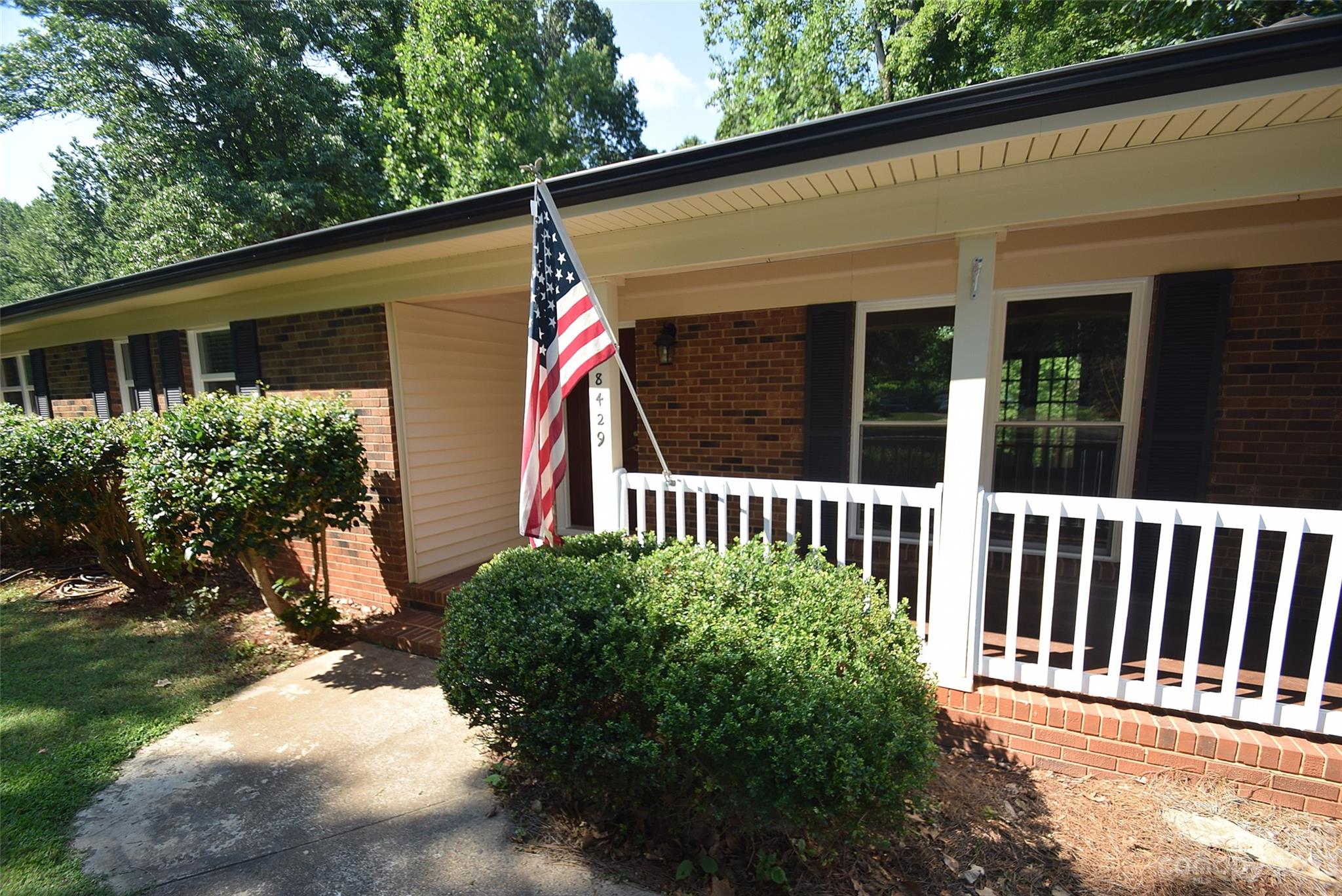 8429 Fieldwood Road Mint Hill, NC 28227 - Photo 2 of 28 a view of a house with a small yard and plants