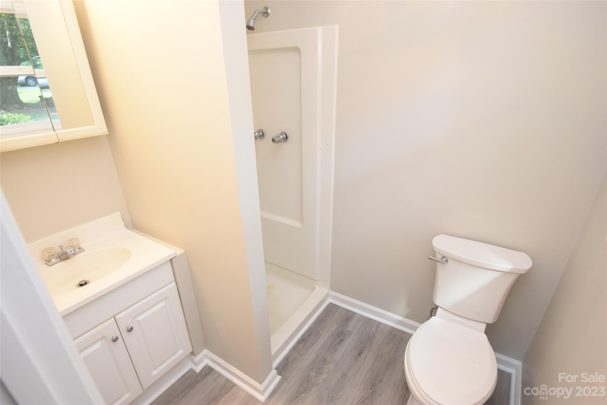 8429 Fieldwood Road Mint Hill, NC 28227 - Photo 22 of 28 a bathroom with a toilet sink and mirror
