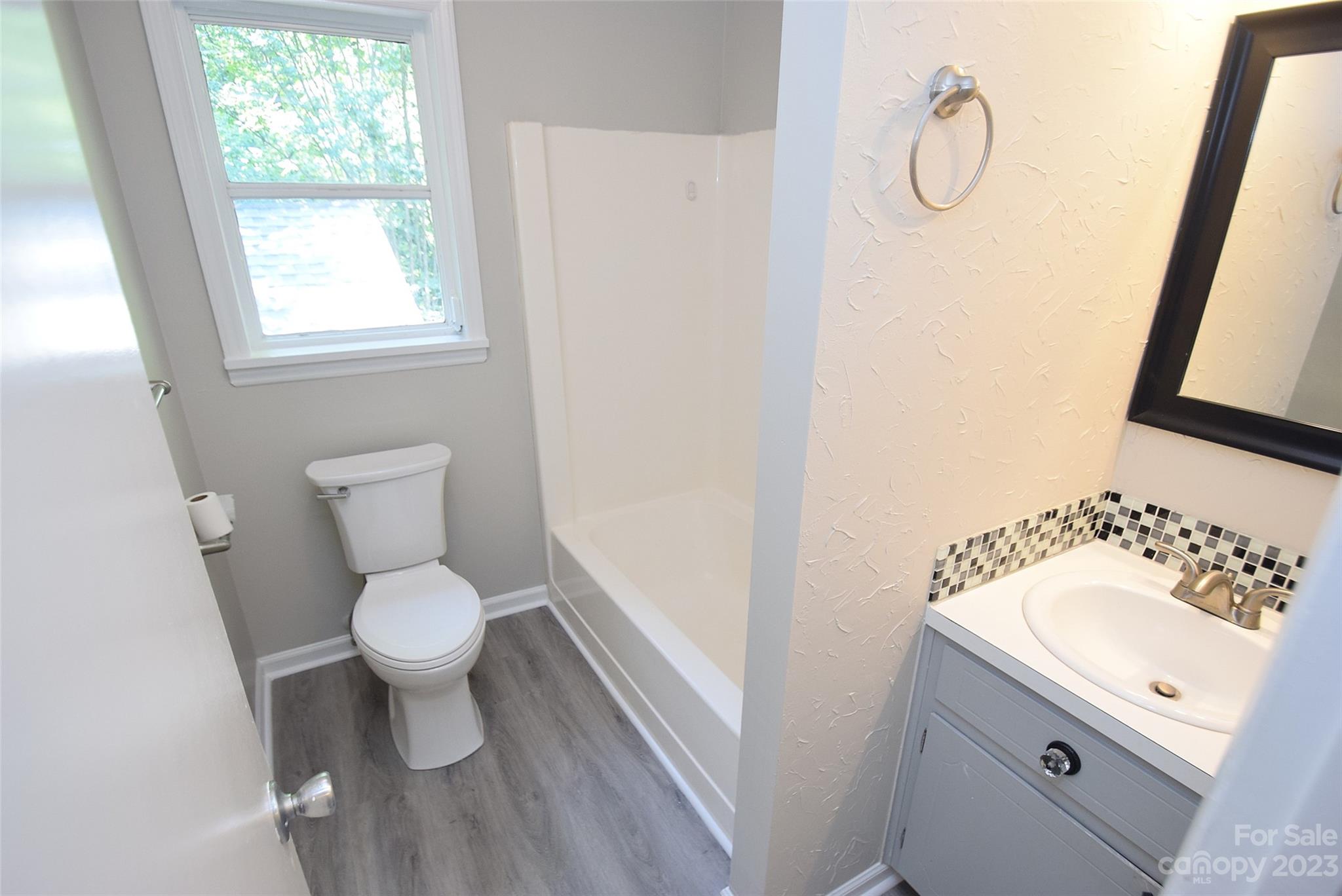 8429 Fieldwood Road Mint Hill, NC 28227 - Photo 25 of 28 a bathroom with a sink toilet and window
