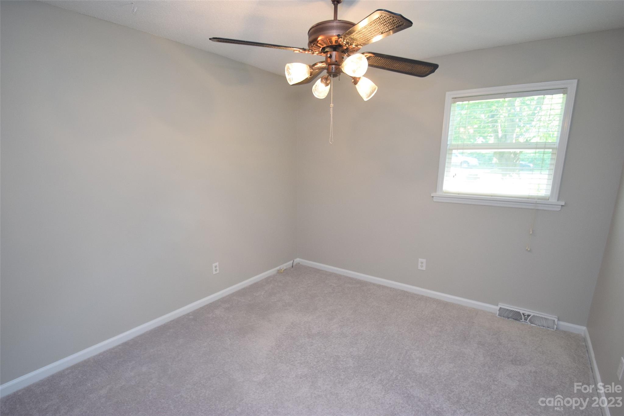 8429 Fieldwood Road Mint Hill, NC 28227 - Photo 26 of 28 an empty room with a window