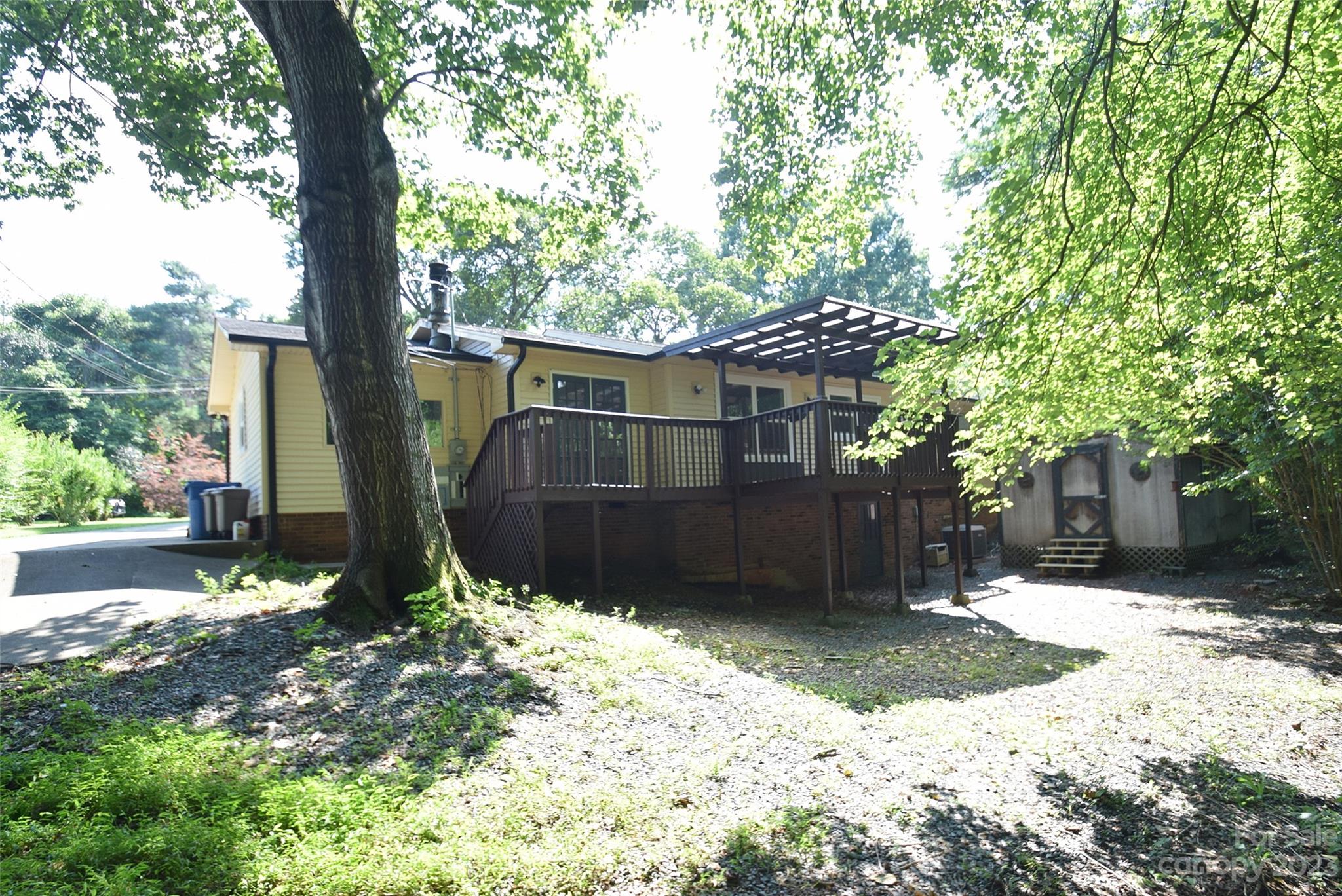 8429 Fieldwood Road Mint Hill, NC 28227 - Photo 4 of 28 a front view of a house with a yard covered in snow and trees