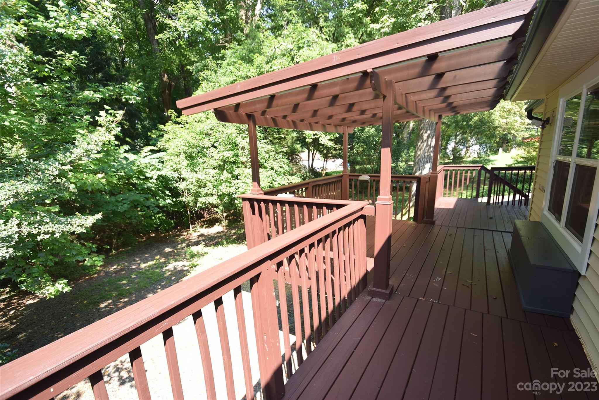 8429 Fieldwood Road Mint Hill, NC 28227 - Photo 8 of 28 a view of a wooden deck with a patio