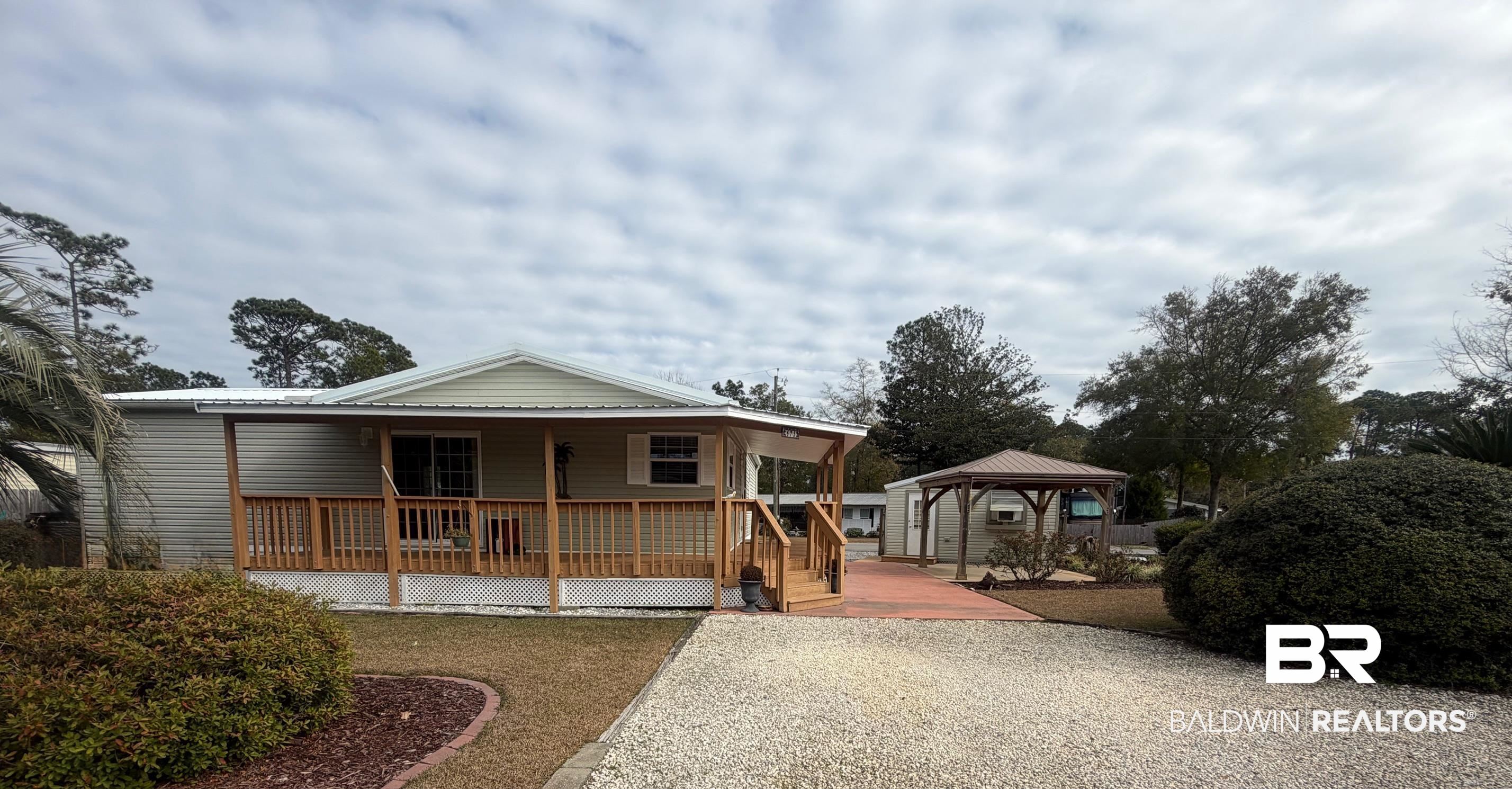 675 Escambia Loop Lillian, AL 36549 - Photo 7 of 44 View of front facade featuring a gazebo and a porch