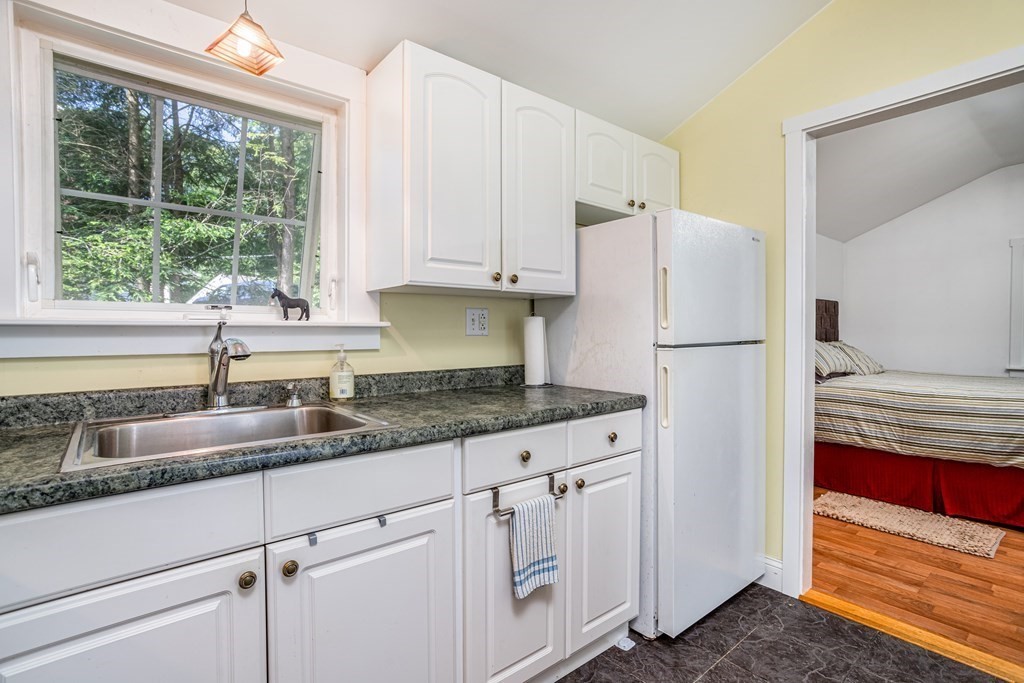 27 Hay Road Ashburnham, MA 01430 - Photo 24 of 42 a kitchen with granite countertop white refrigerator and sink