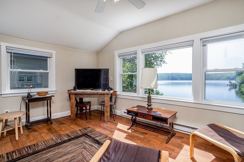 27 Hay Road Ashburnham, MA 01430 - Photo 30 of 42 a living room with furniture a flat screen tv and a window