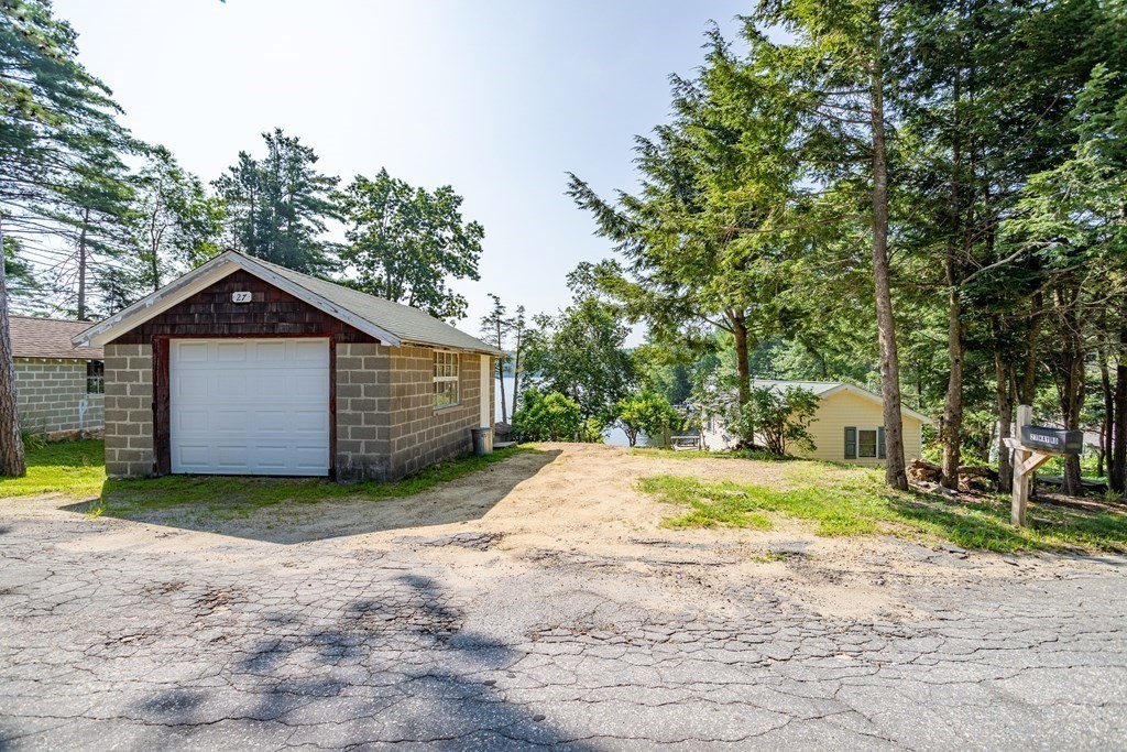 27 Hay Road Ashburnham, MA 01430 - Photo 40 of 42 a view of a house with large trees and wooden fence