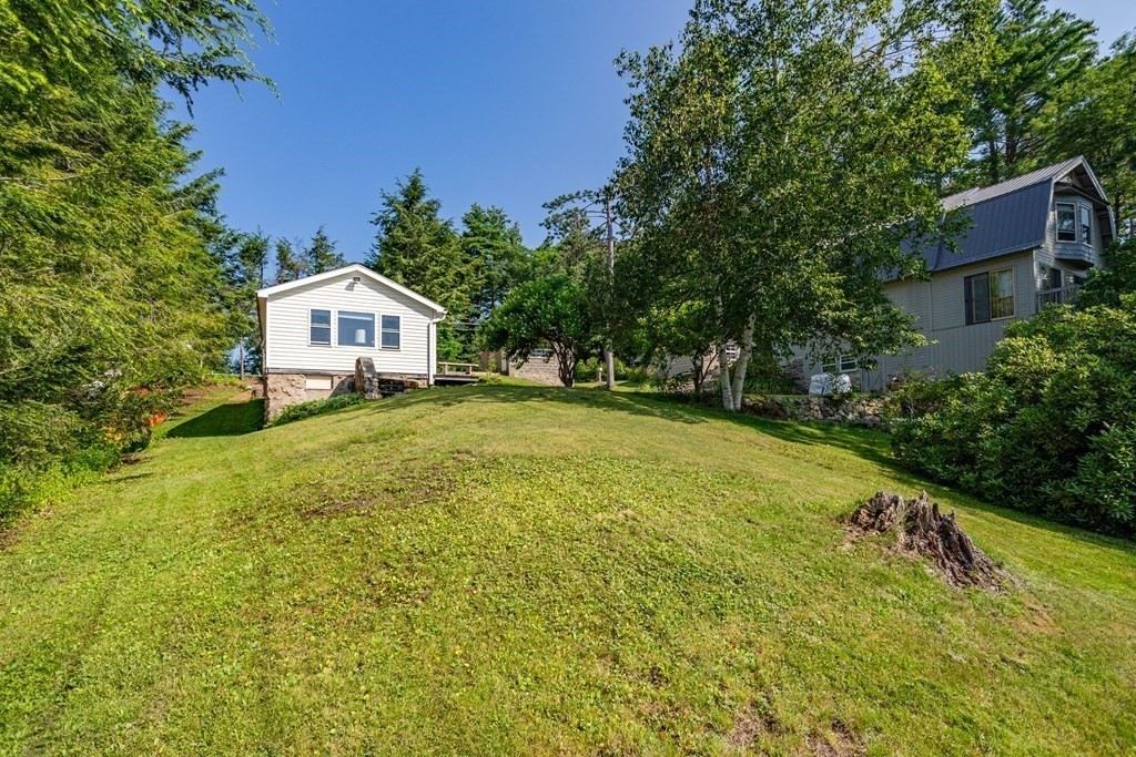 27 Hay Road Ashburnham, MA 01430 - Photo 4 of 42 a view of a house with a yard and sitting area