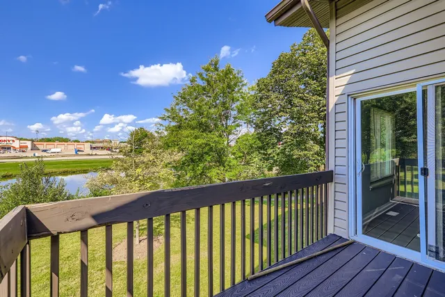 a view of a balcony with wooden floor
