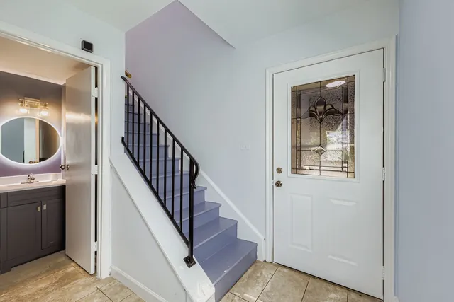 a view of entryway and hall with wooden floor