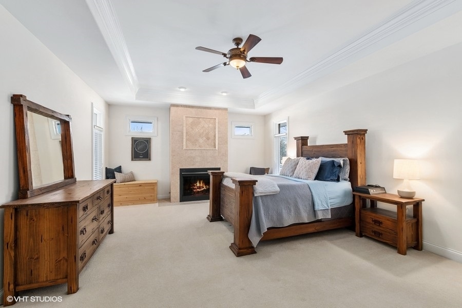 24042 Old Farm Road Manhattan, IL 60442 - Photo 15 of 32 a bed room with furniture and a flat screen tv