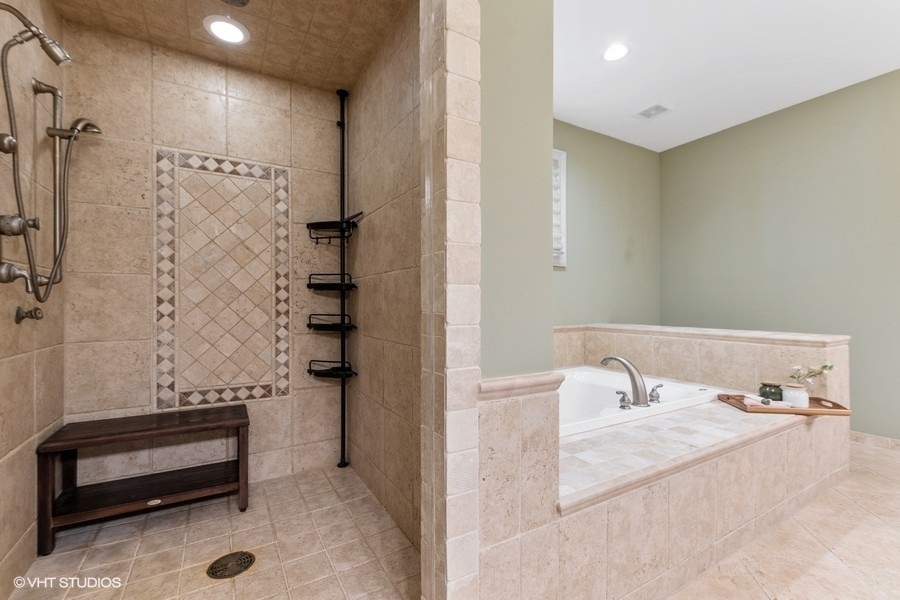 24042 Old Farm Road Manhattan, IL 60442 - Photo 18 of 32 a bathroom with a bathtub and shower