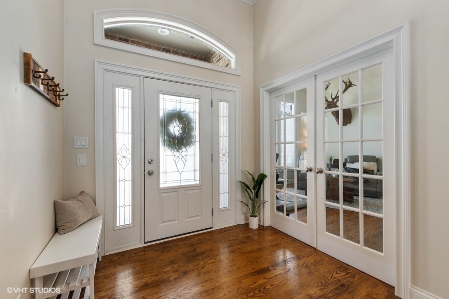 24042 Old Farm Road Manhattan, IL 60442 - Photo 2 of 32 a view of a livingroom with wooden floor and furniture