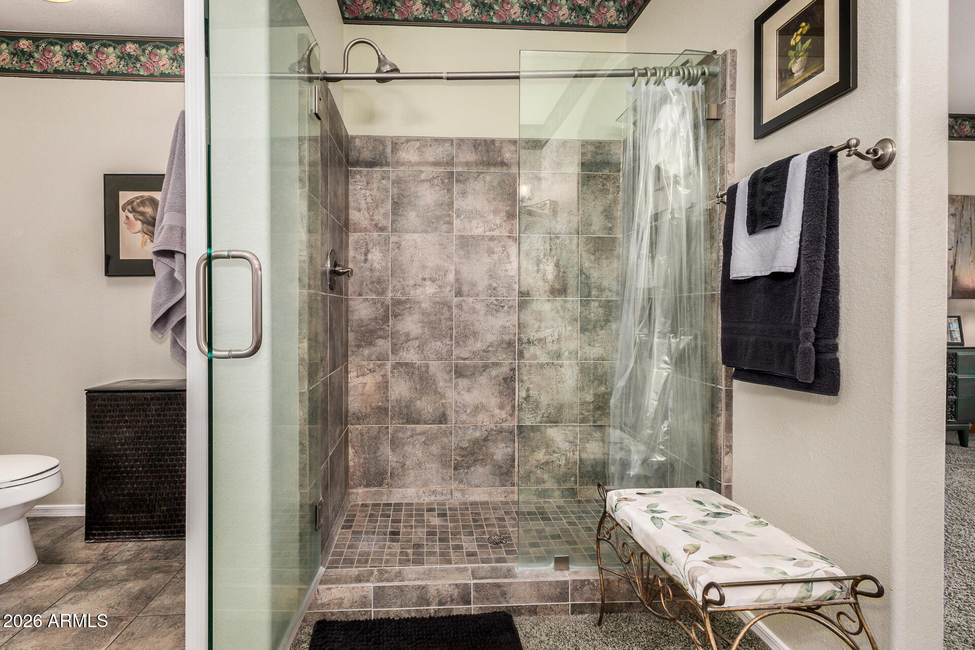 8508 West Utopia Road Peoria, AZ 85382 - Photo 18 of 28 a bathroom with a shower and a toilet