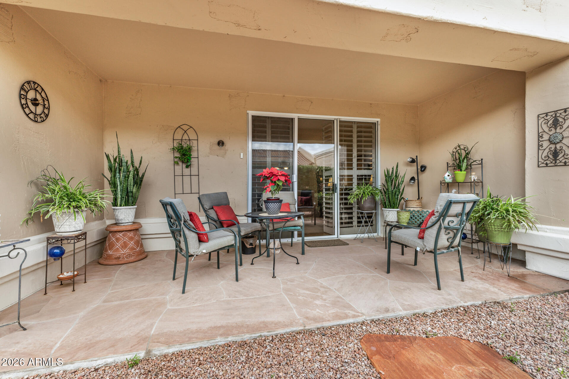 8508 West Utopia Road Peoria, AZ 85382 - Photo 24 of 28 a living room with furniture and a potted plant