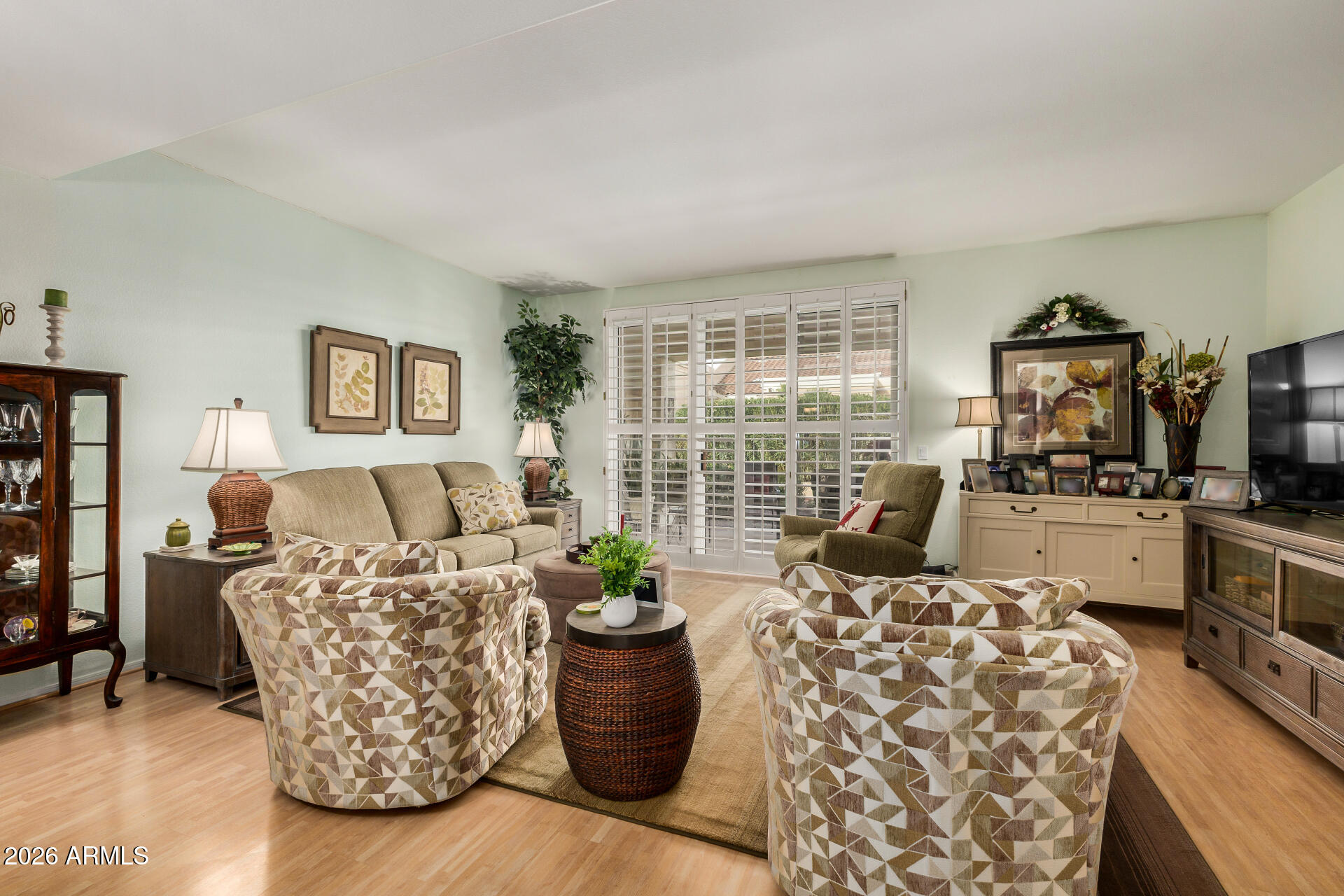 8508 West Utopia Road Peoria, AZ 85382 - Photo 5 of 28 a living room with furniture and a flat screen tv