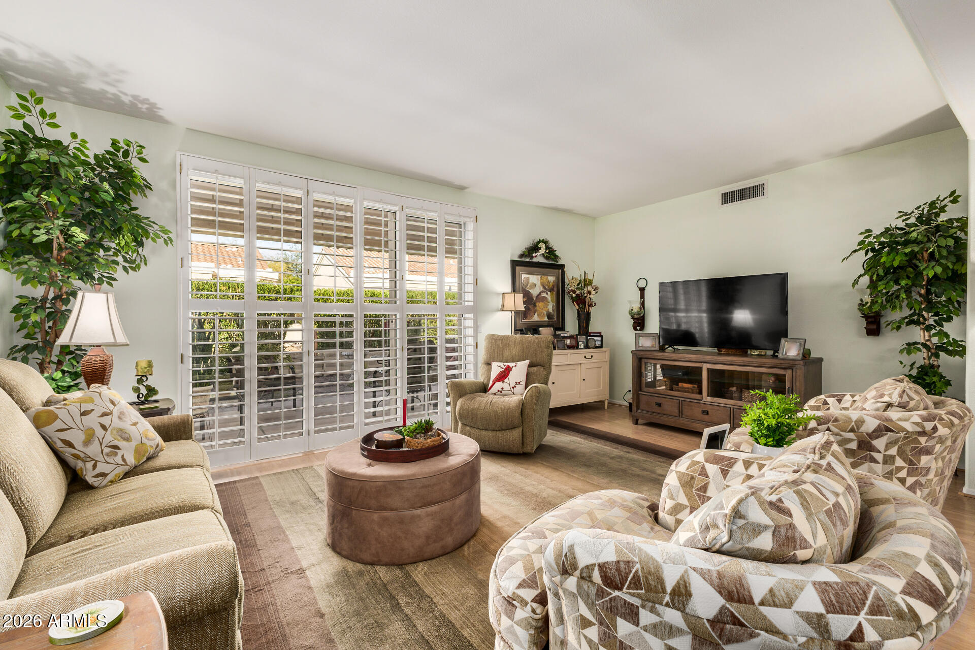 8508 West Utopia Road Peoria, AZ 85382 - Photo 6 of 28 a living room with furniture and a flat screen tv