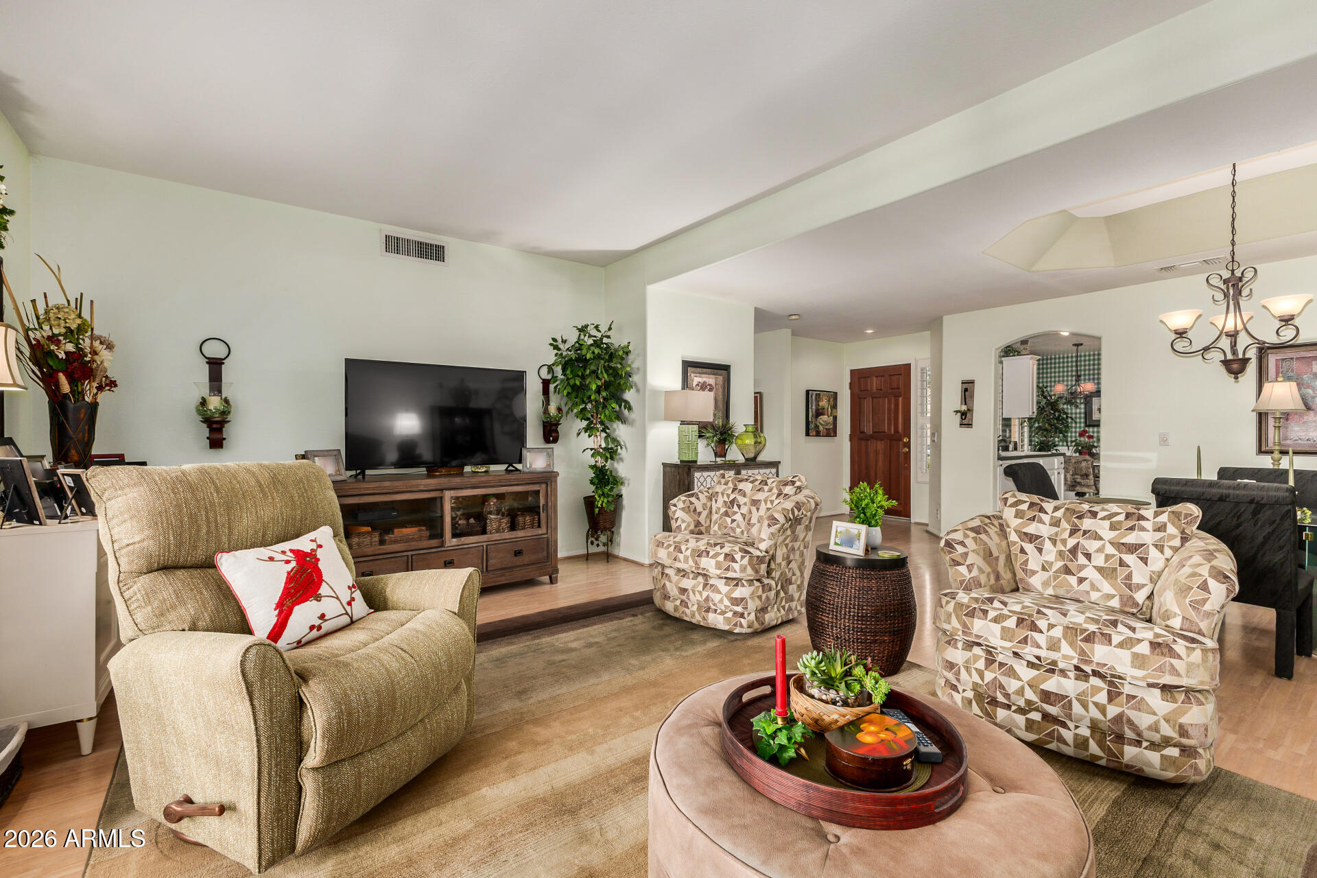 8508 West Utopia Road Peoria, AZ 85382 - Photo 7 of 28 a living room with furniture and a flat screen tv