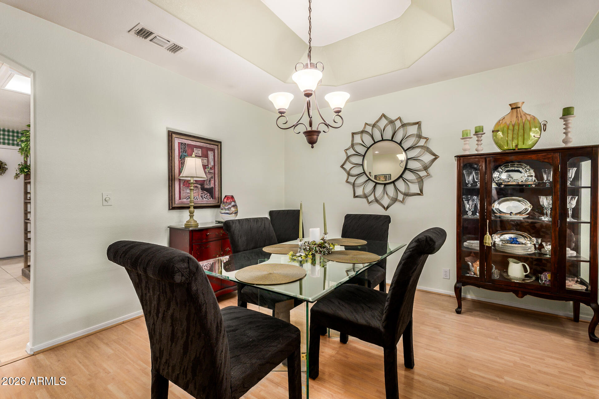 8508 West Utopia Road Peoria, AZ 85382 - Photo 9 of 28 a dining room with furniture and chandelier