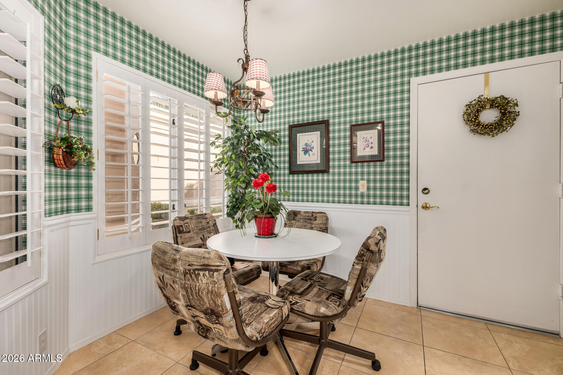 8508 West Utopia Road Peoria, AZ 85382 - Photo 10 of 28 a dining room with furniture wooden floor and a chandelier