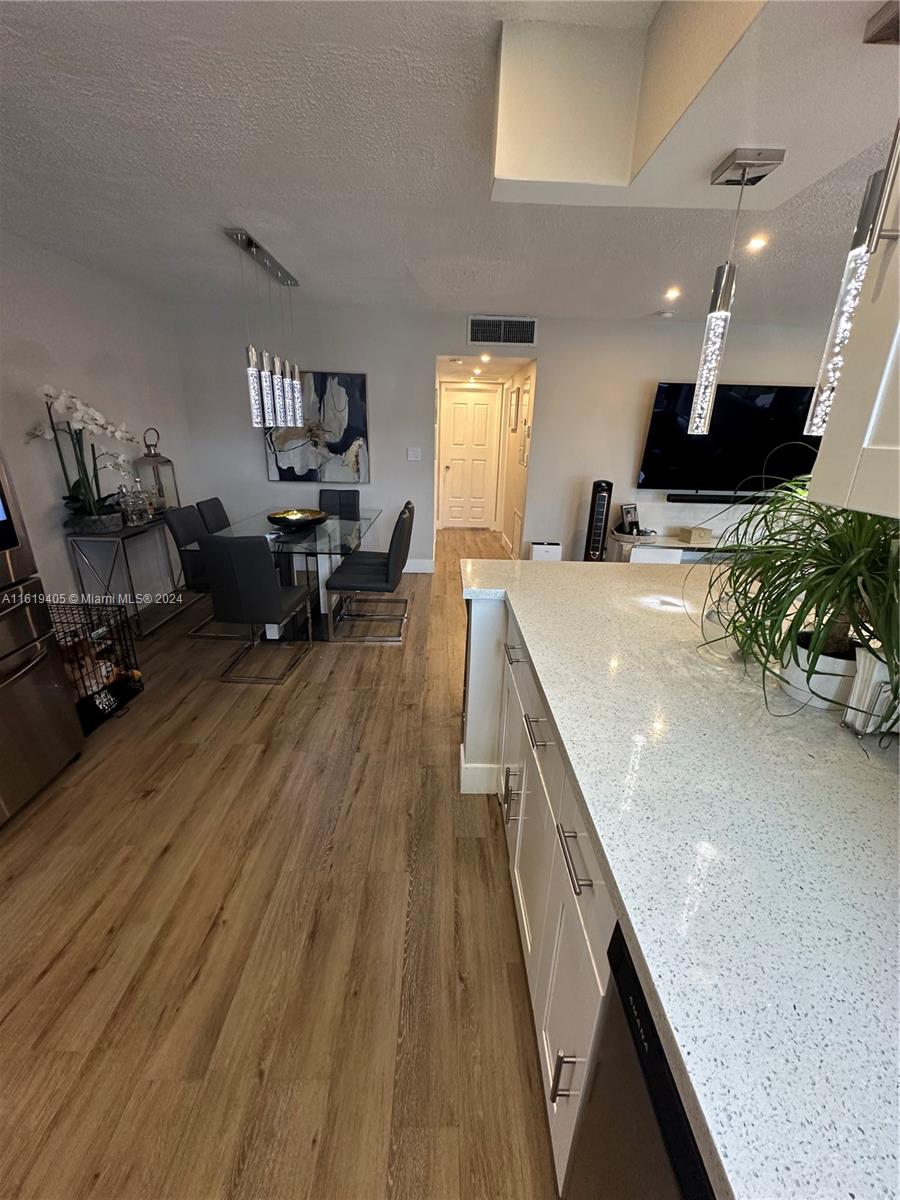6791 Pershing Street Hollywood, FL 33024 - Photo 13 of 31 a living room with furniture and a wooden floor