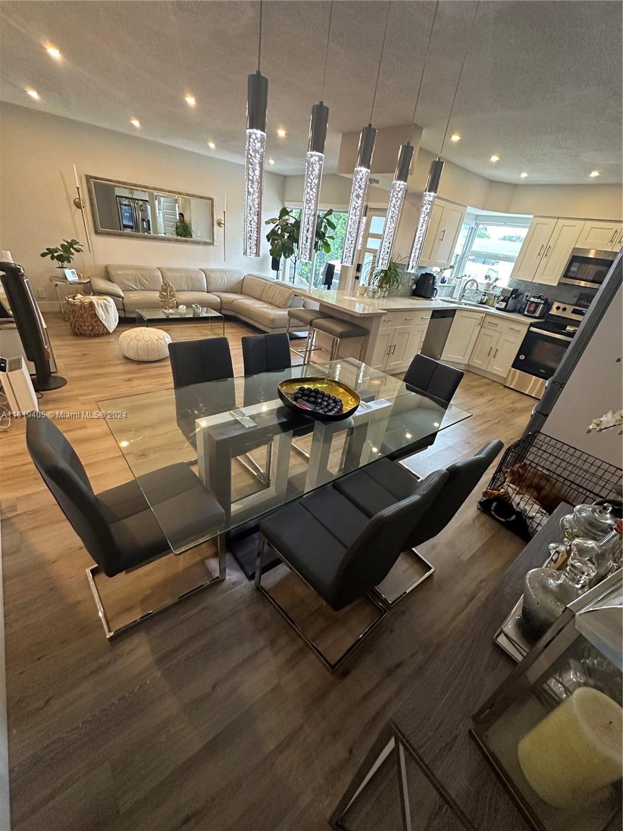 6791 Pershing Street Hollywood, FL 33024 - Photo 14 of 31 a living room with furniture and a wooden floor