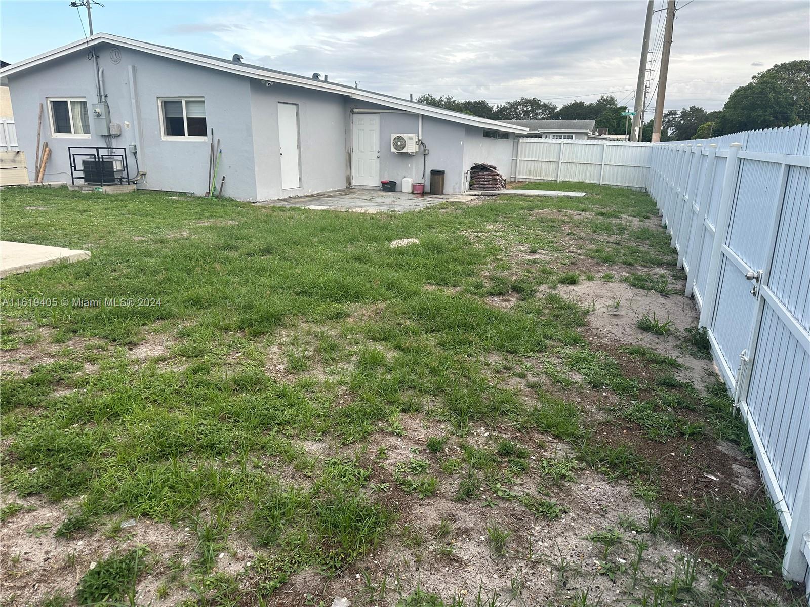 6791 Pershing Street Hollywood, FL 33024 - Photo 29 of 31 a view of a house with backyard and garden