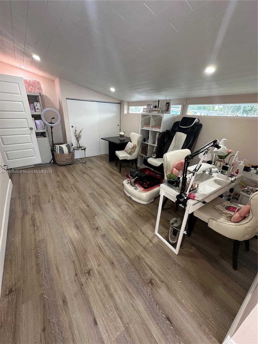 6791 Pershing Street Hollywood, FL 33024 - Photo 6 of 31 a living room with furniture and a wooden floor