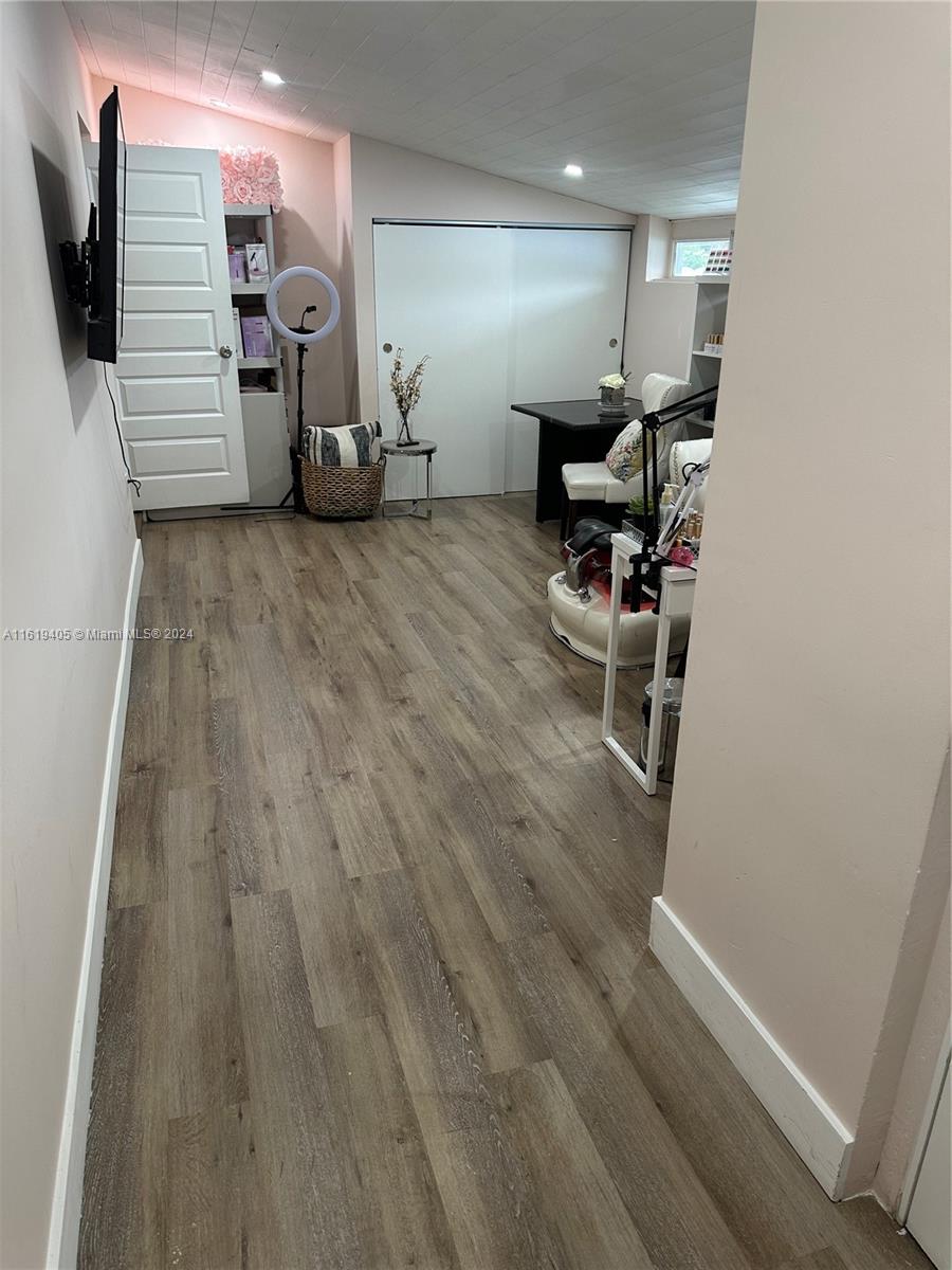 6791 Pershing Street Hollywood, FL 33024 - Photo 7 of 31 a view of a livingroom with furniture and a flat screen tv