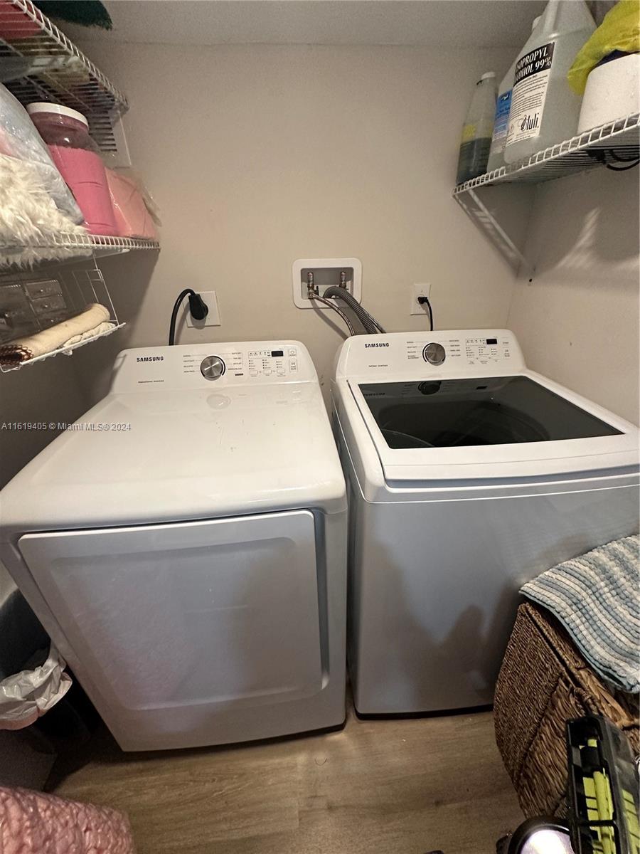 6791 Pershing Street Hollywood, FL 33024 - Photo 9 of 31 a utility room with dryer and washer