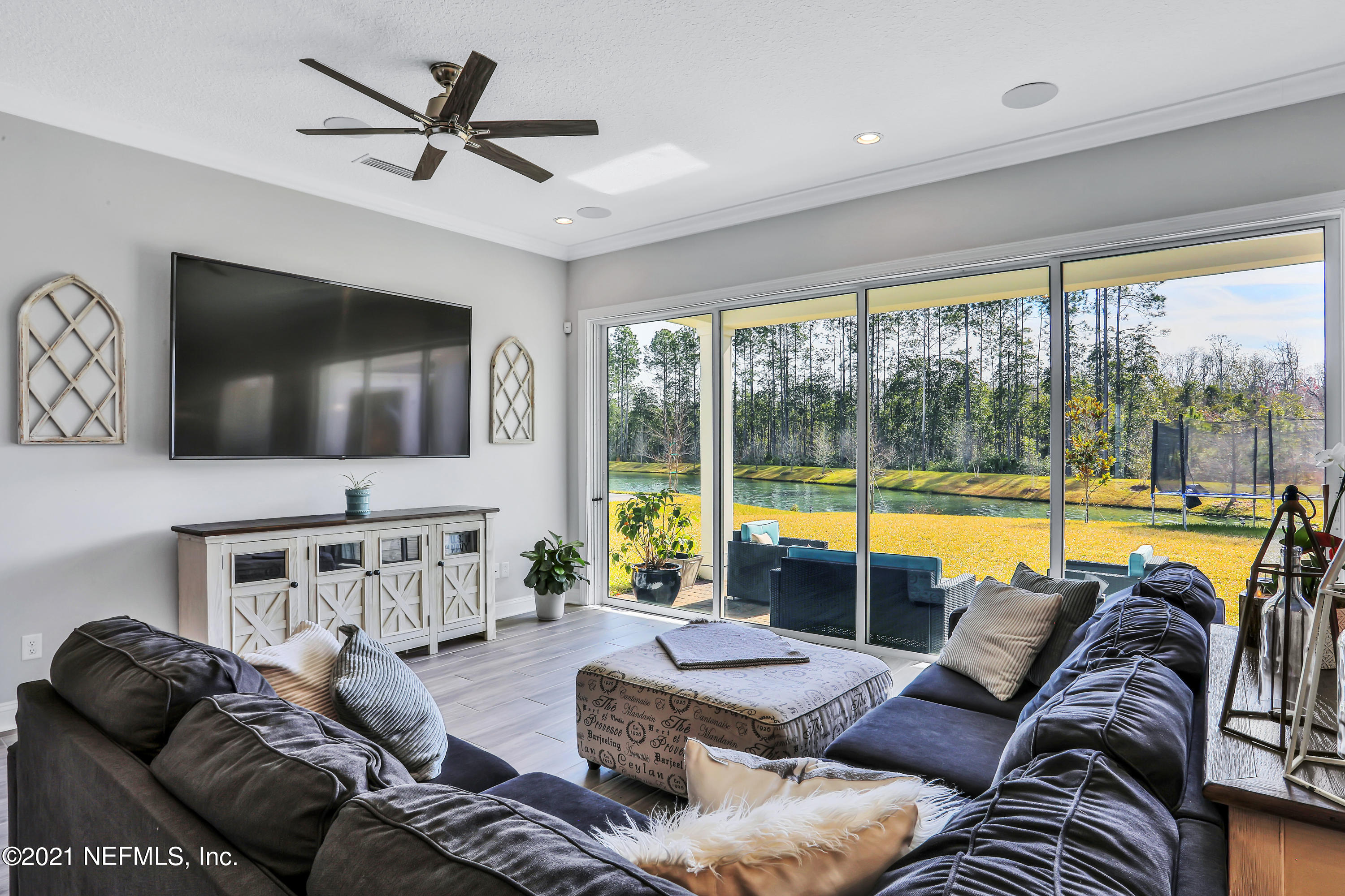 140 Pine Haven Drive St. Johns, FL 32259 - Photo 18 of 66 a living room with furniture and a flat screen tv