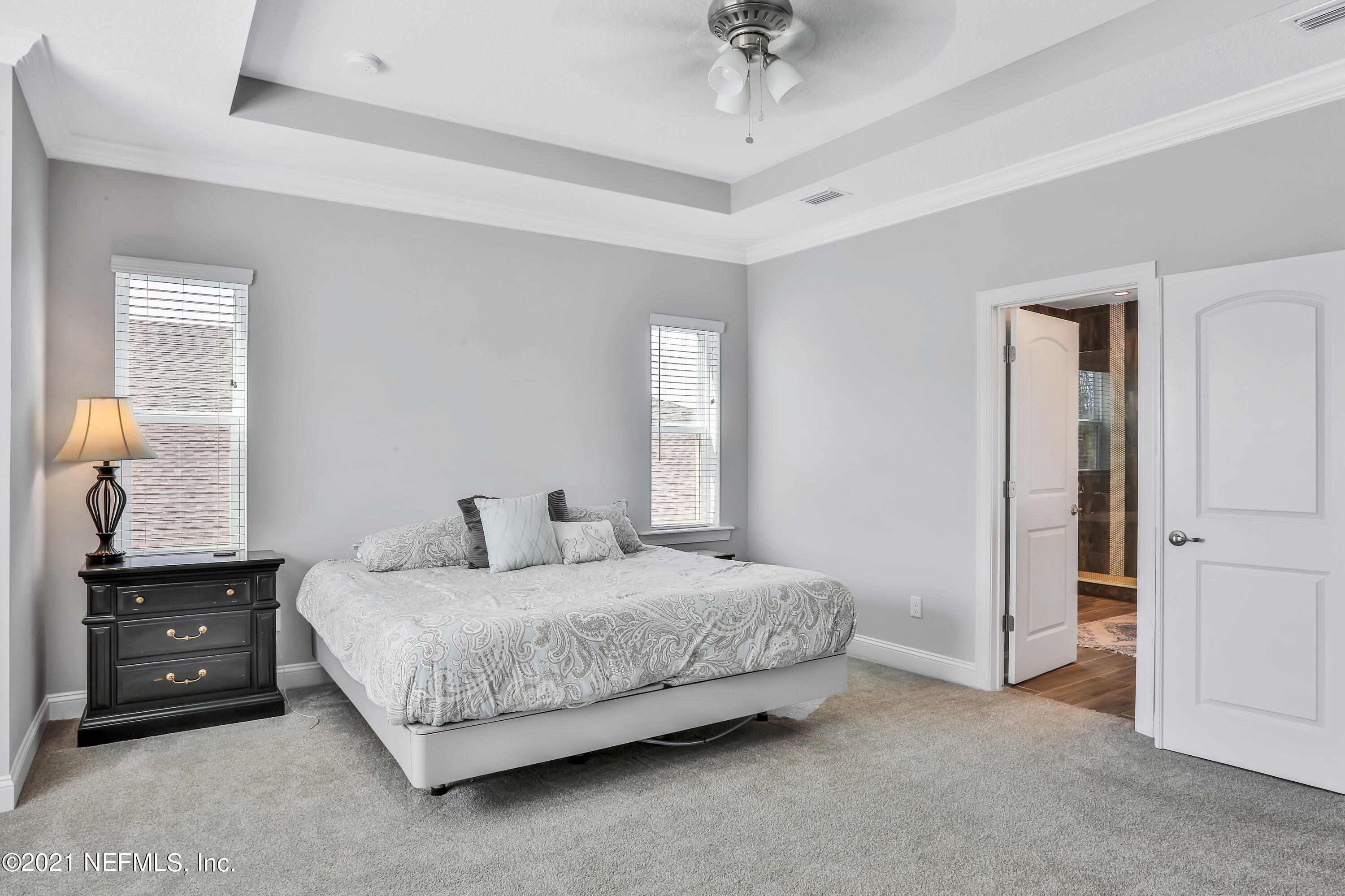 140 Pine Haven Drive St. Johns, FL 32259 - Photo 43 of 66 a bedroom with a bed and a night stand