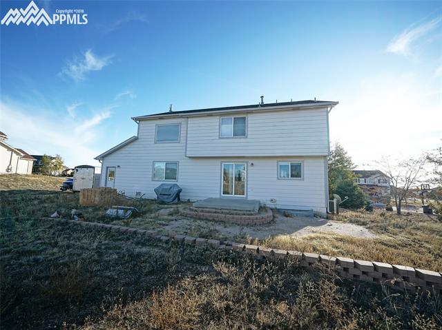 8572 Tibbs Road Peyton, CO 80831 - Photo 16 of 20 Exterior back of beautiful home!