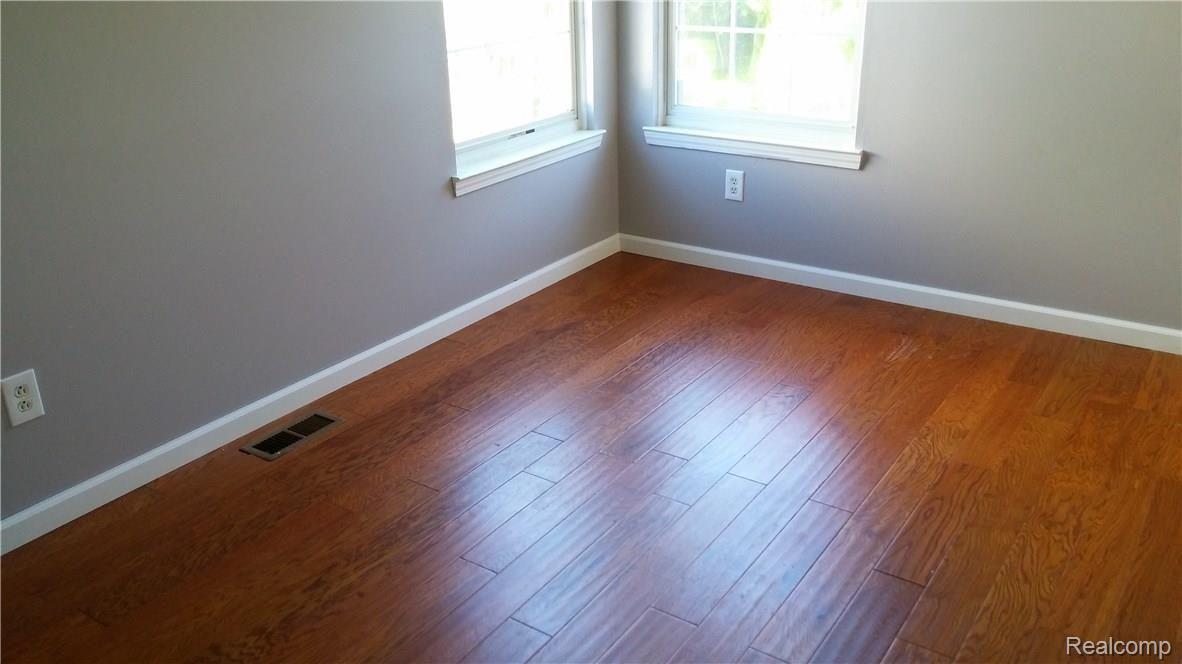 825 3rd Street Fenton, MI 48430 - Photo 20 of 26 Bedroom 3 has wood flooring too.