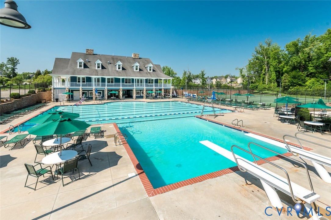 5149 Lake Summer Loop Moseley, VA 23120 - Photo 3 of 12 a view of a swimming pool with lawn chairs and plants