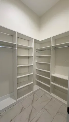 a view of closet area with empty racks