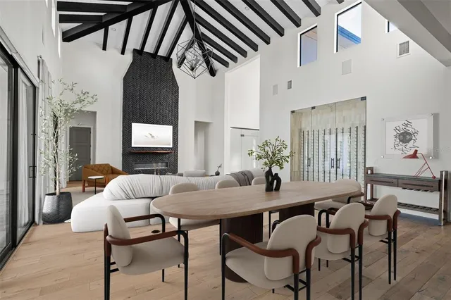 a spacious bedroom with a bed and a large window