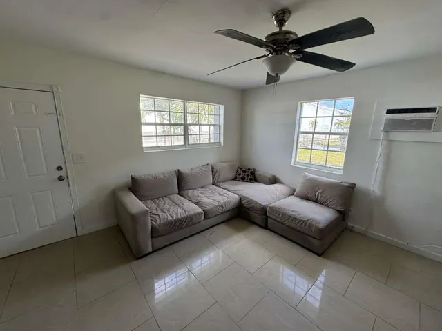 a living room with furniture and a window