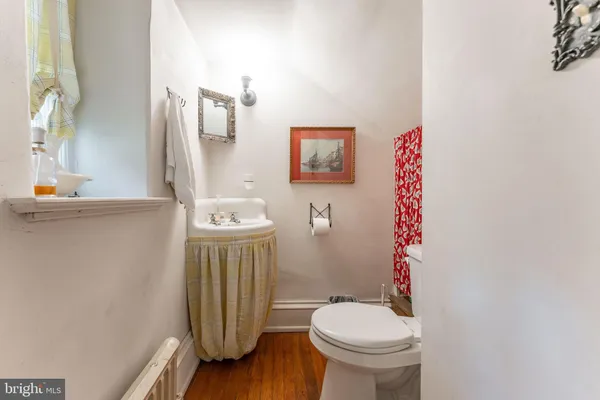 a view of a dining room with furniture and a chandelier