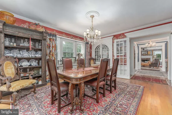 a living room with furniture a rug and a fireplace