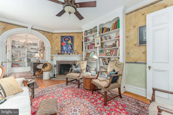 a living room with furniture and a rug