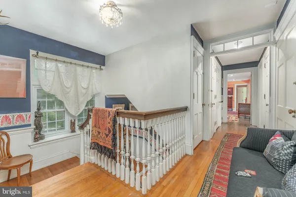 a bathroom with a sink toilet mirror and tub