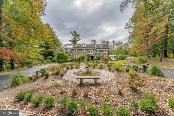 a view of a livingroom with furniture hardwood floor and a chandelier