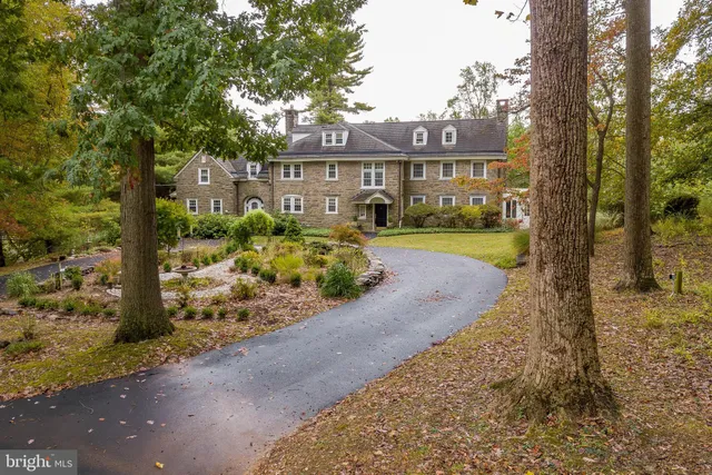 a bedroom with furniture and a large window