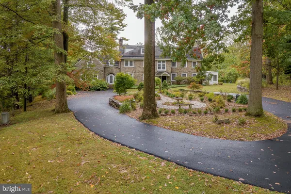 a living room with furniture large window and fireplace