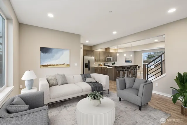 a living room with furniture and a potted plant