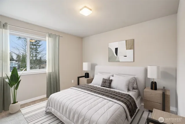 a bedroom with a bed and a window