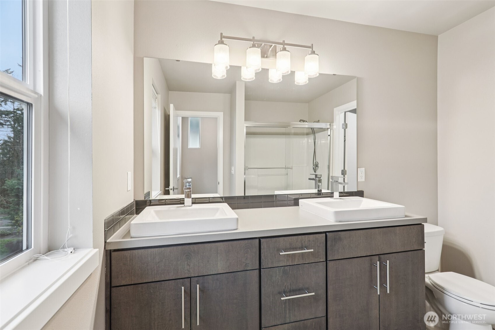 13724 Ash Way, Unit F3 Everett, WA 98204 - Photo 22 of 28 a bathroom with a sink and a mirror