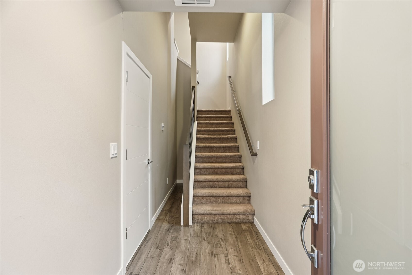 13724 Ash Way, Unit F3 Everett, WA 98204 - Photo 5 of 28 a view of a hallway with wooden floor and entryway